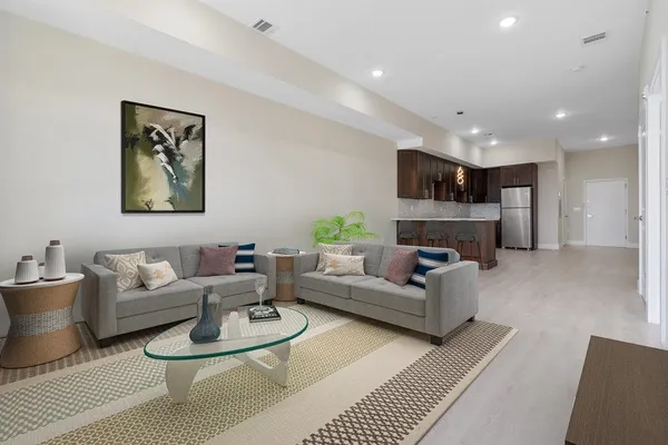 a living room with furniture and a fireplace