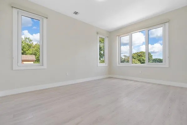 a view of an empty room with a window