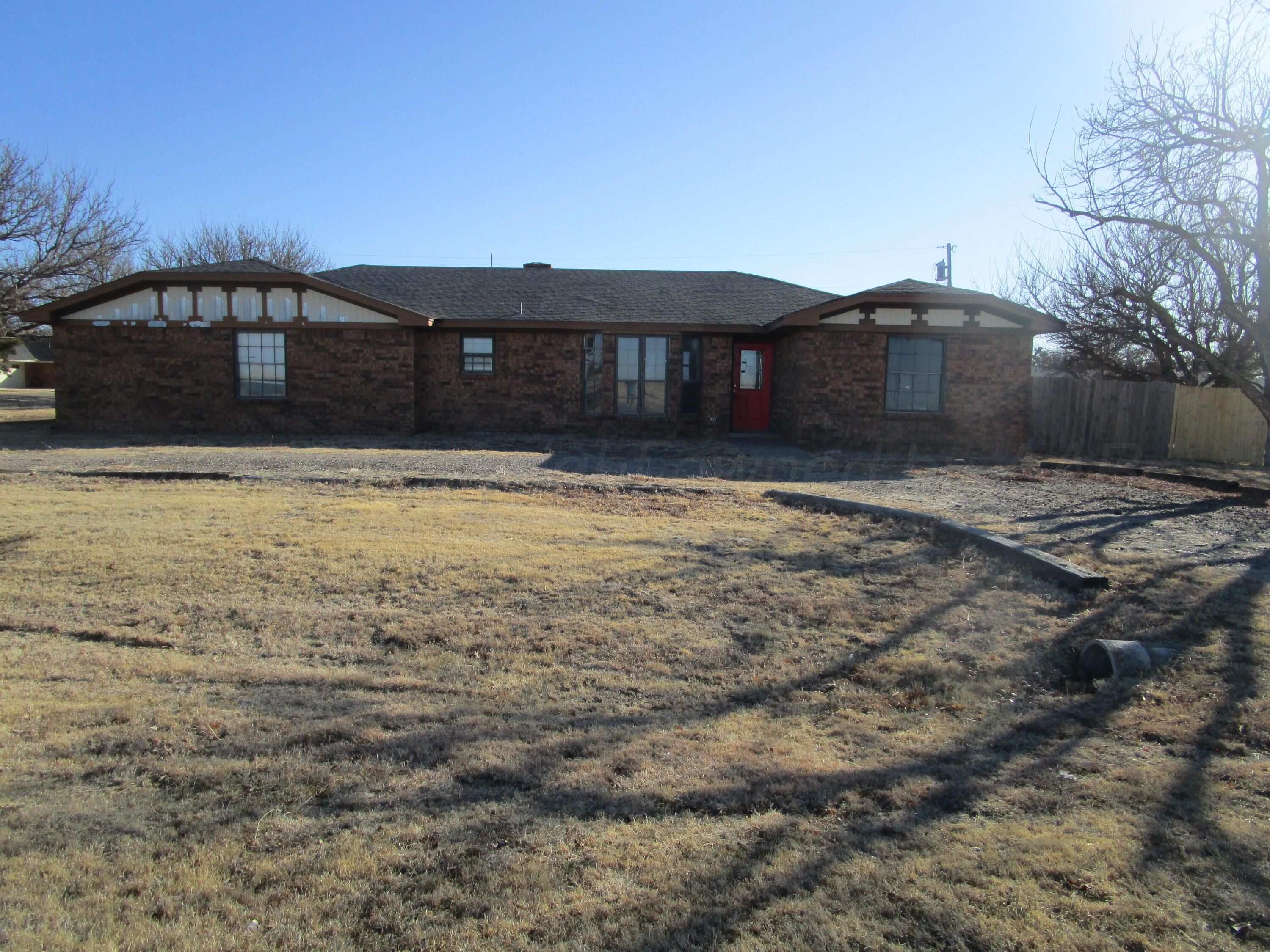 601 Alamo Street Claude, TX 79019 - Photo 1 of 30 a front view of a house with a yard