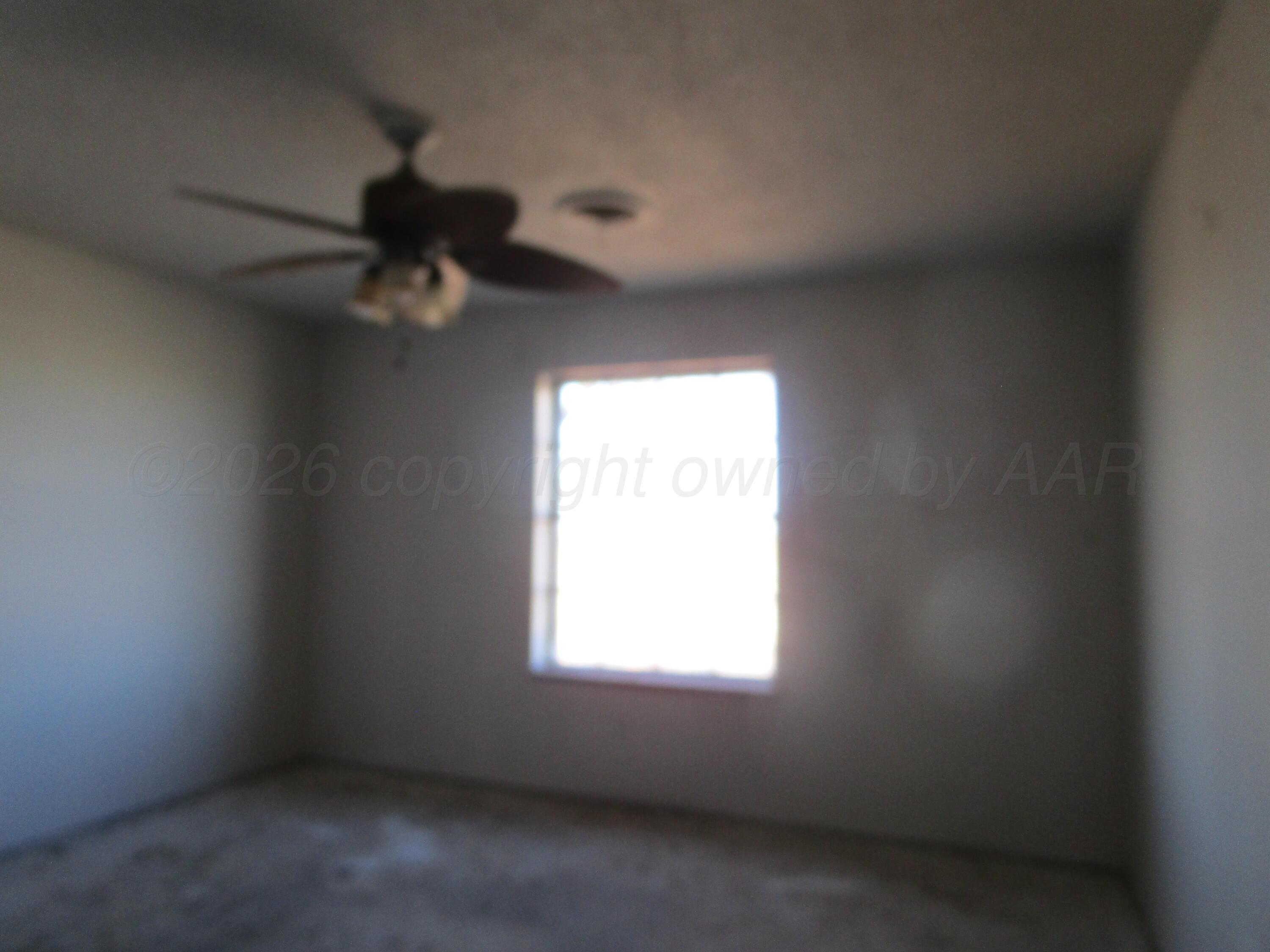 601 Alamo Street Claude, TX 79019 - Photo 12 of 30 an empty room with a window