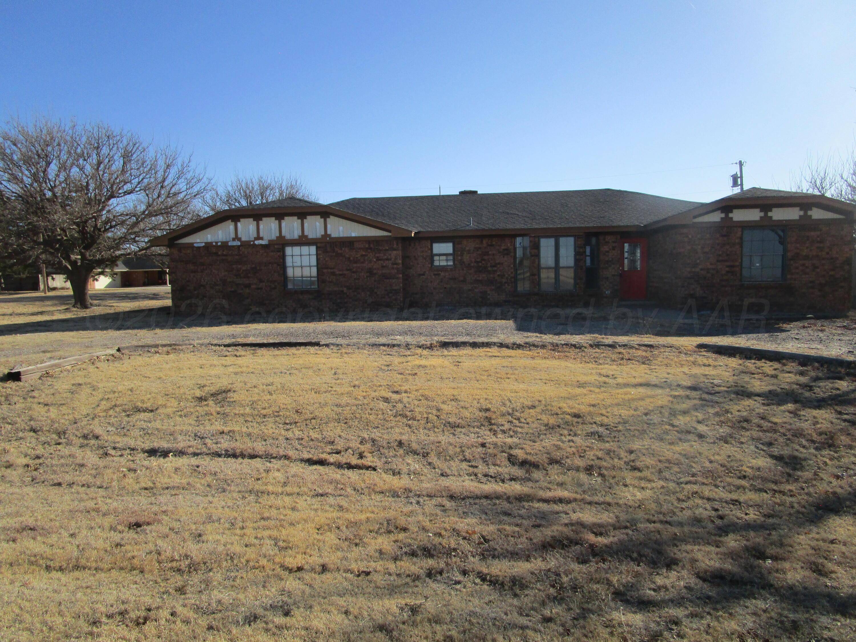 601 Alamo Street Claude, TX 79019 - Photo 26 of 30 a front view of a house with a yard