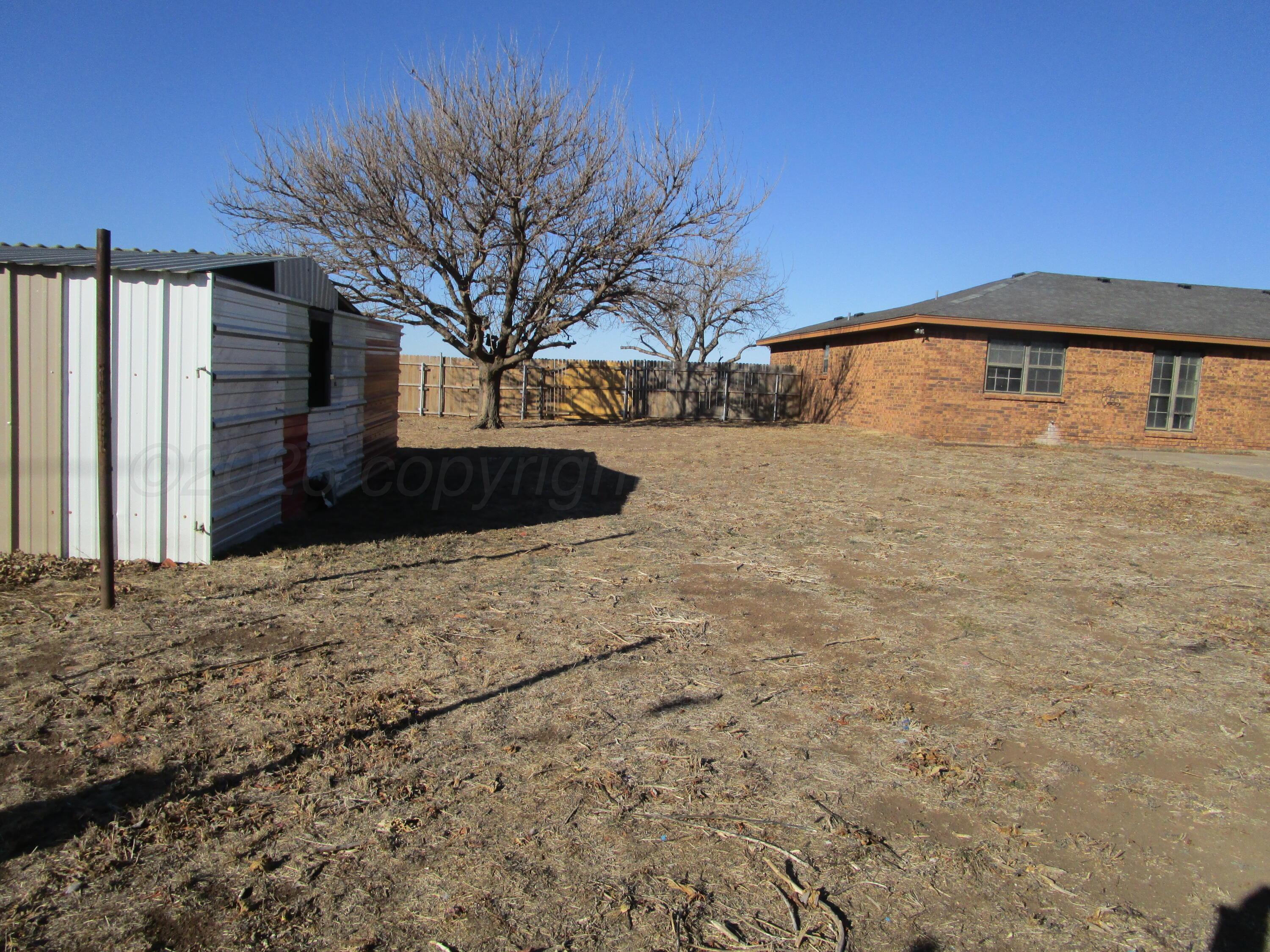 601 Alamo Street Claude, TX 79019 - Photo 9 of 30 a front view of a house with a yard