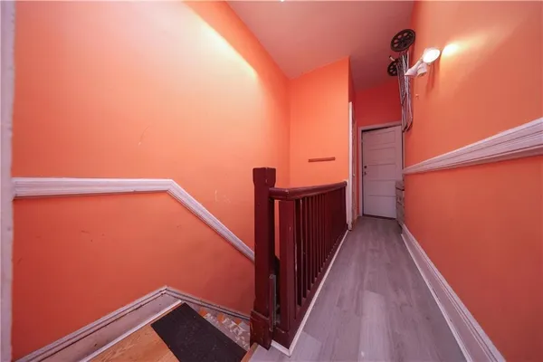 a view of a balcony with wooden floor