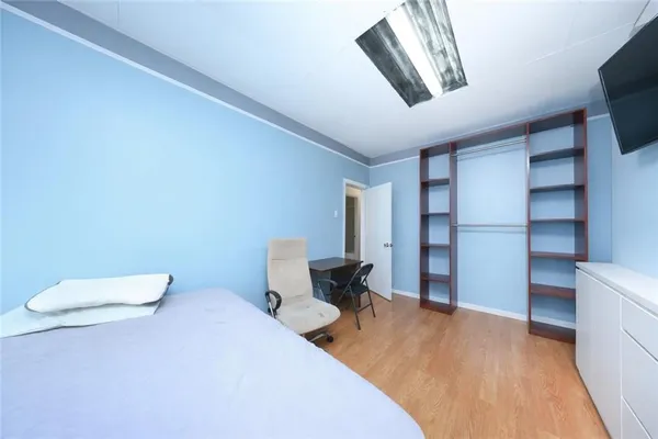 a bedroom with a bed and furniture