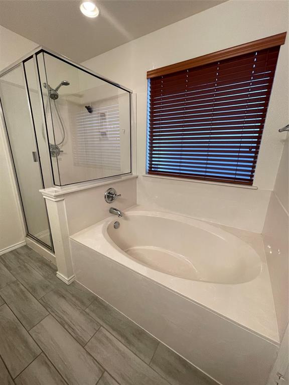 904 Watson Way Pflugerville, TX 78660 - Photo 12 of 16 Full bath featuring a shower stall, a bath, and recessed lighting