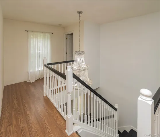 a front view of a residential apartment building with a yard