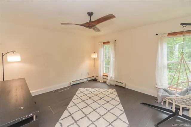 a bedroom with a bed dresser and a window