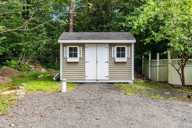 a bedroom with a bed and flat screen tv
