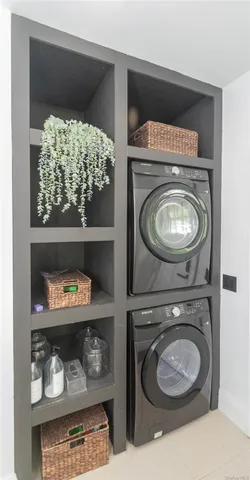 a bedroom with a bed and a mirror