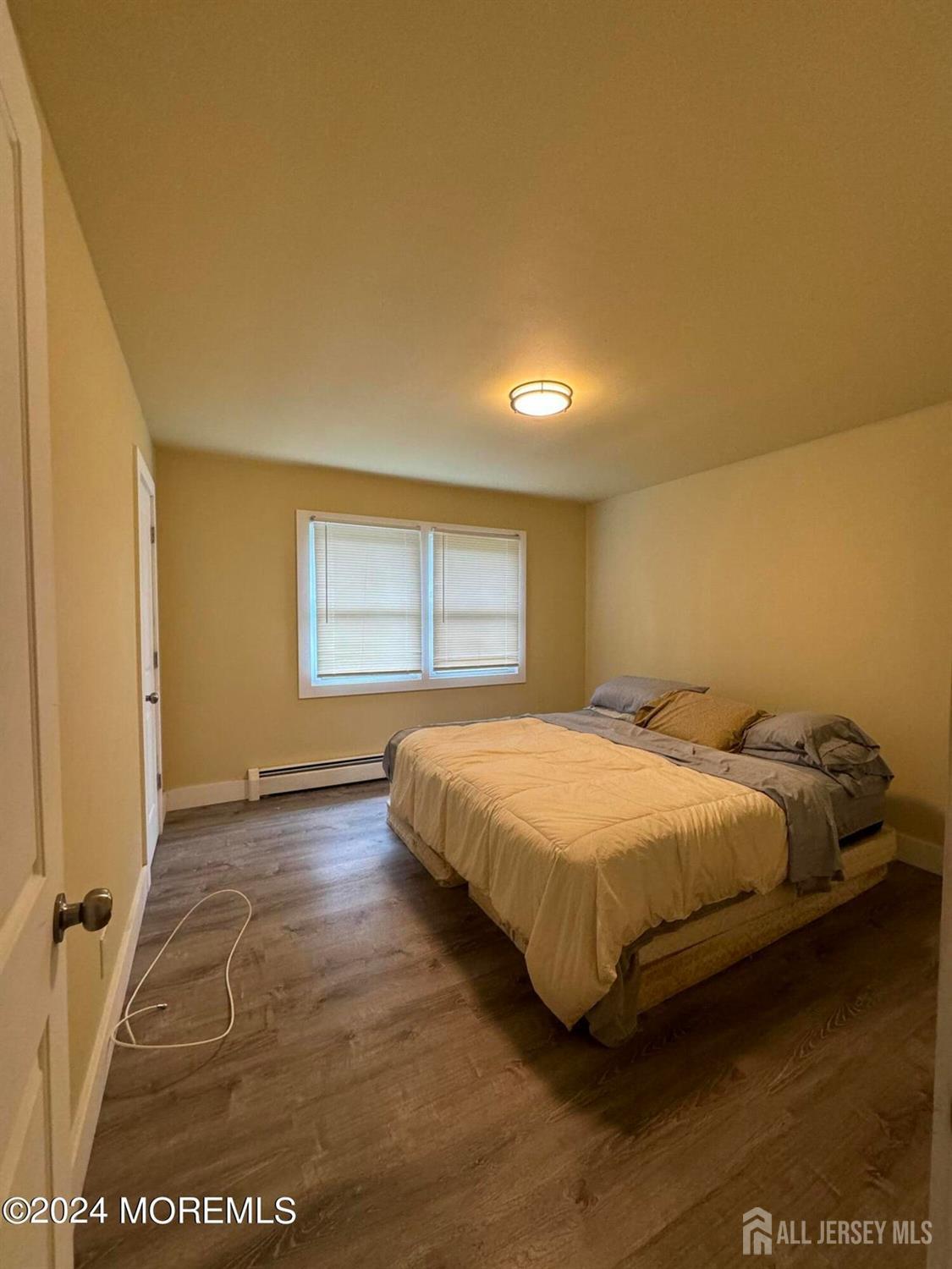 42 East 5th Street Howell, NJ 07731 - Photo 5 of 6 a bed sitting in a bedroom next to a window