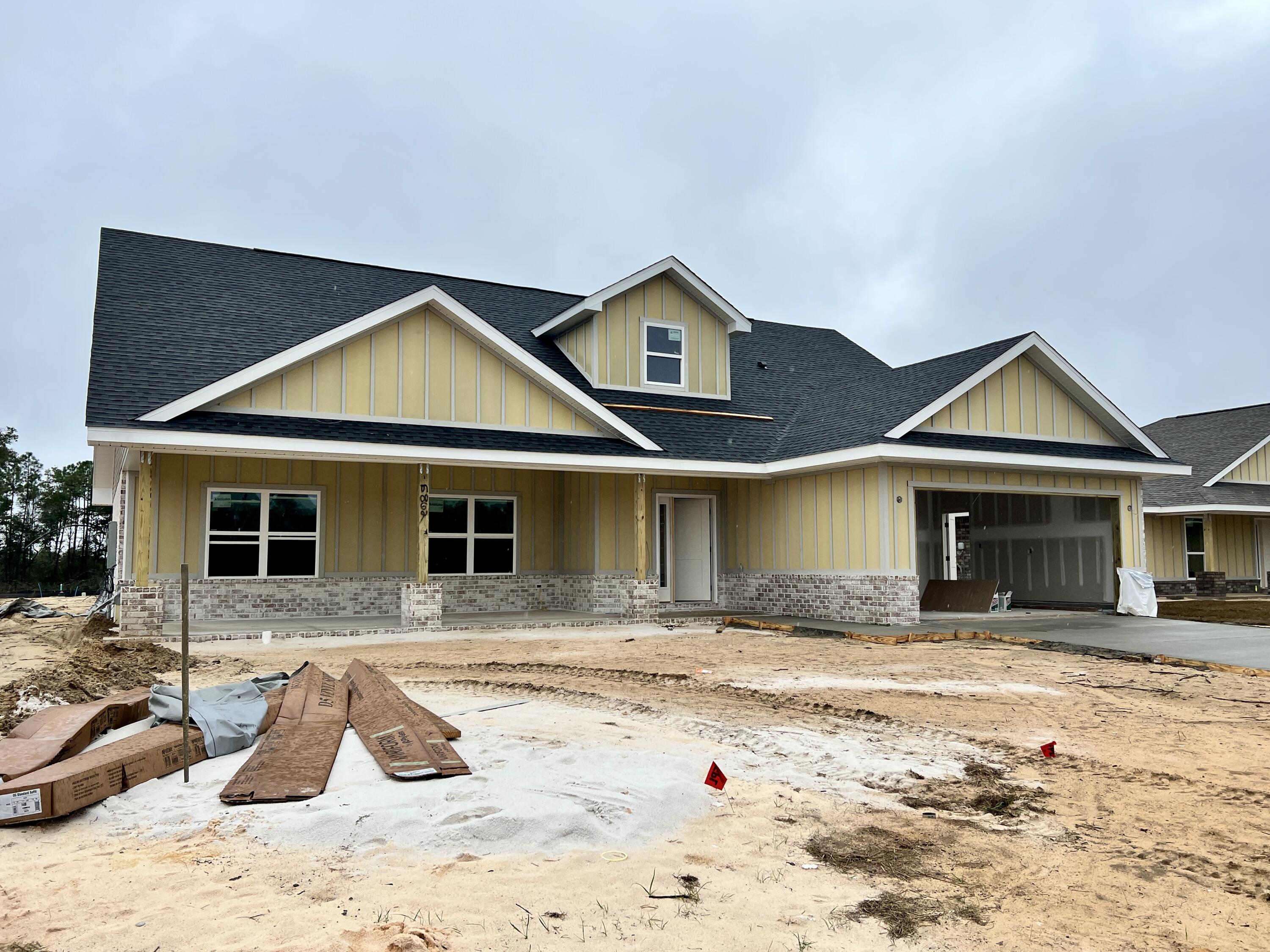 7639 Small Pnes Street Milton, FL 32583 - Photo 2 of 2 a front view of a house with a yard