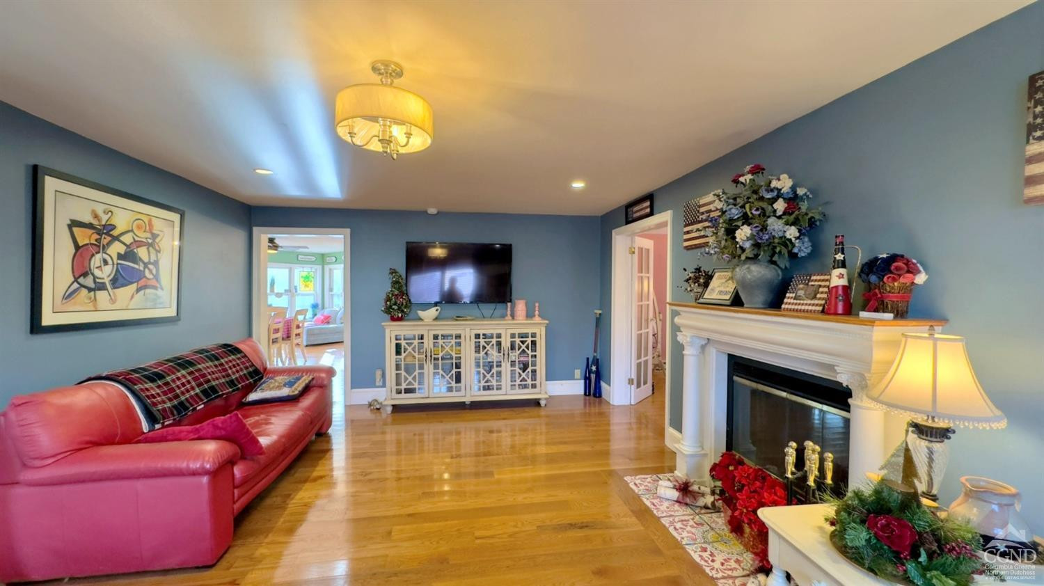 66 Castle Point Road Athens, NY 12015 - Photo 12 of 40 a living room with furniture a fireplace and a flat screen tv