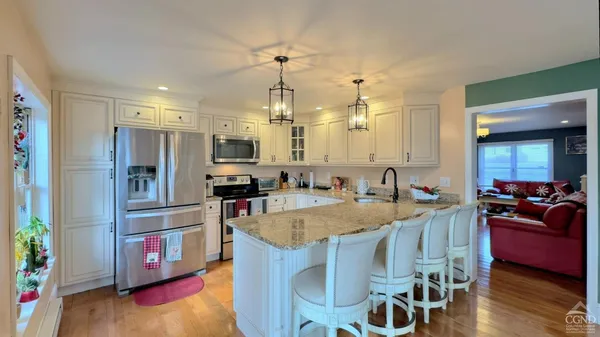 a large kitchen with lots of counter space and refrigerator