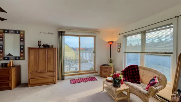 a bedroom with furniture and a window