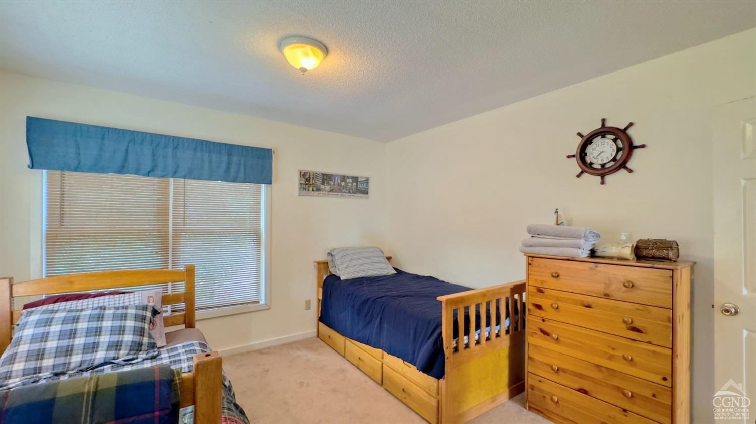 66 Castle Point Road Athens, NY 12015 - Photo 30 of 40 a bedroom with a bed and wooden floor