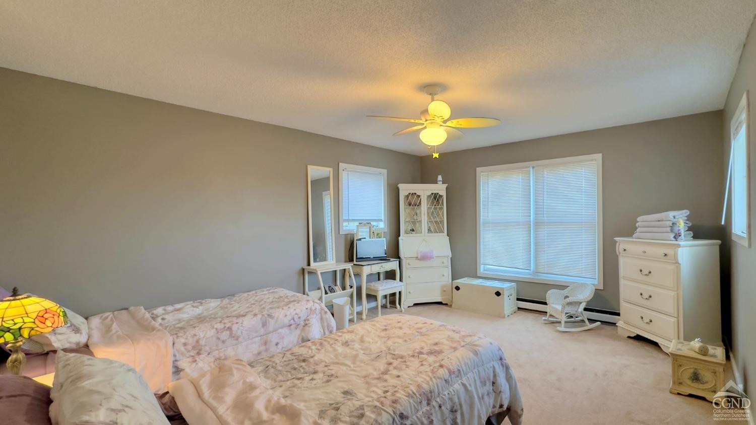 66 Castle Point Road Athens, NY 12015 - Photo 33 of 40 a bedroom with a bed and a chandelier