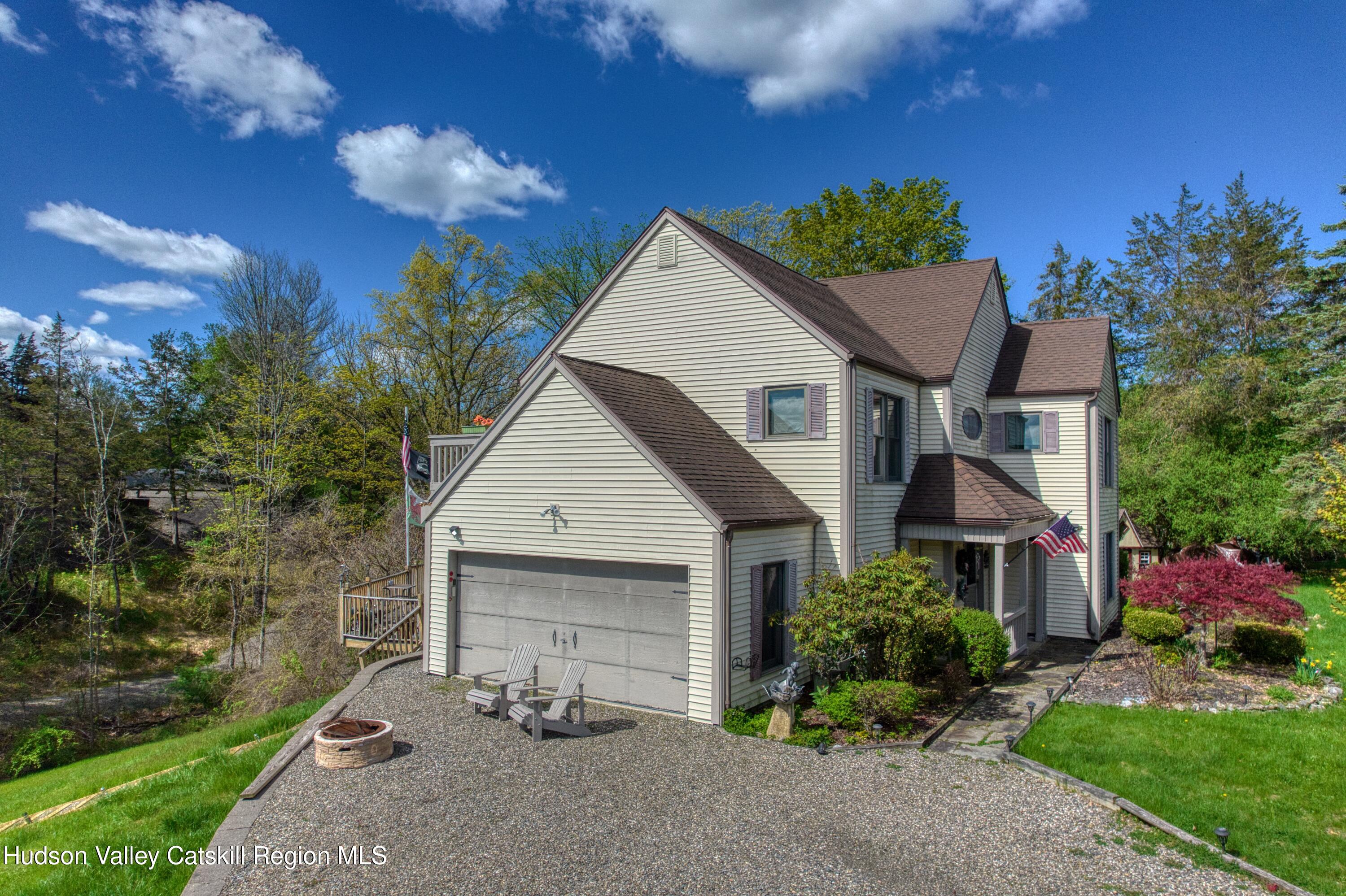 66 Castle Point Road Athens, NY 12015 - Photo 6 of 40 a view of a house with yard and a garden