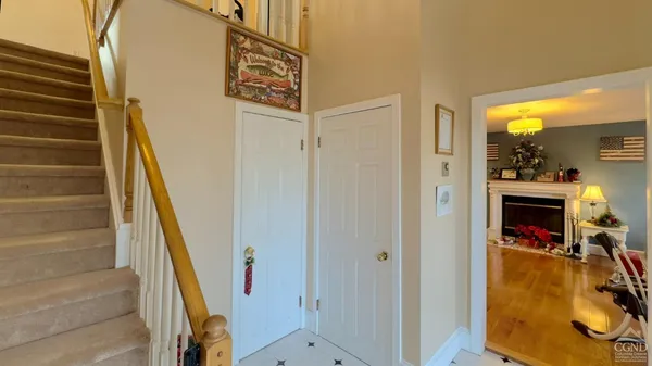 a view of a livingroom with furniture and stairs
