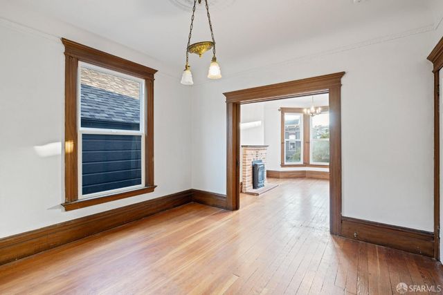 a kitchen with granite countertop a sink and cabinets
