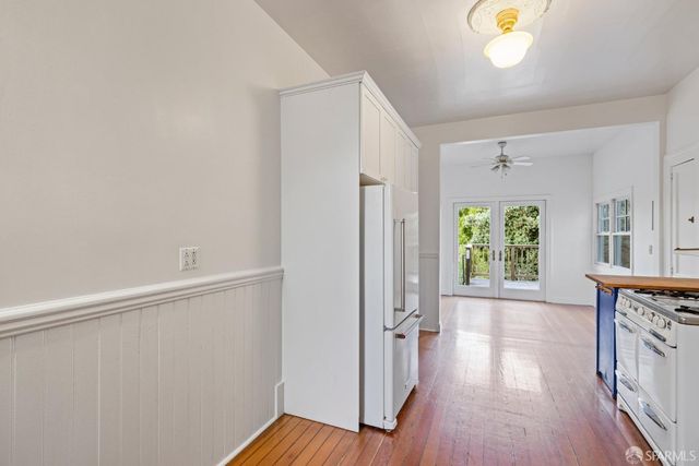 a kitchen with stainless steel appliances granite countertop a stove and a refrigerator