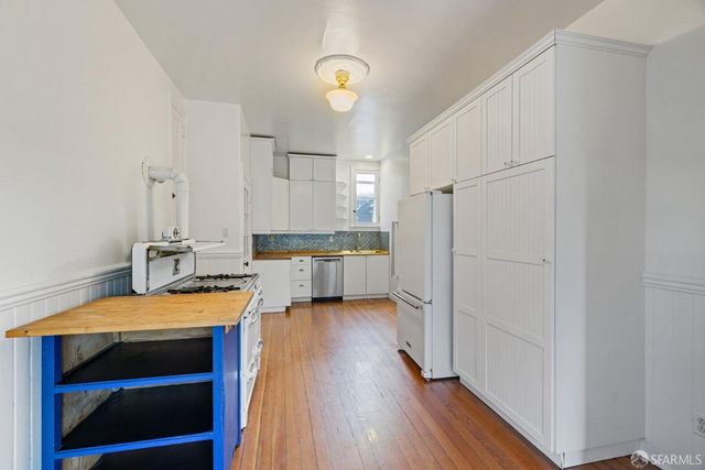 a view of livingroom with window wooden floor and front door