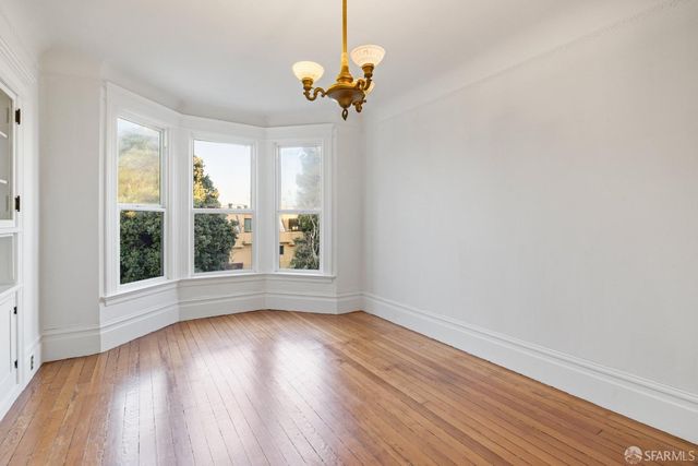 a view of a brick house with a large window