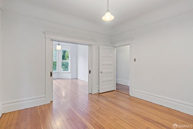 a view of balcony with wooden floor and fence and floor