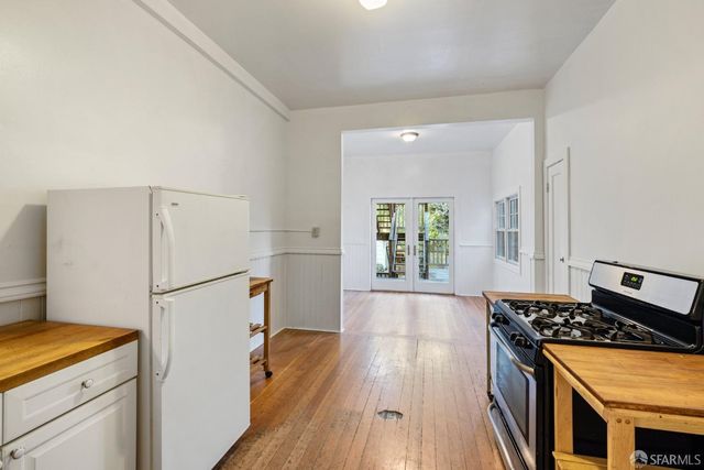 an aerial view of residential houses with city view