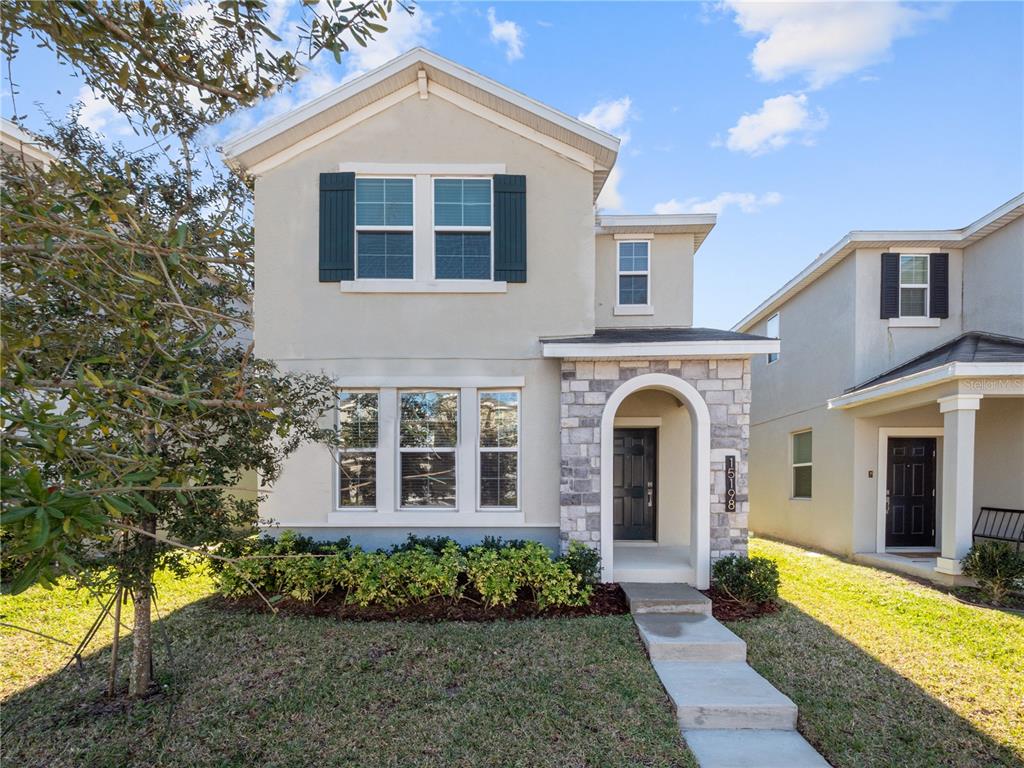 a front view of a house with a yard