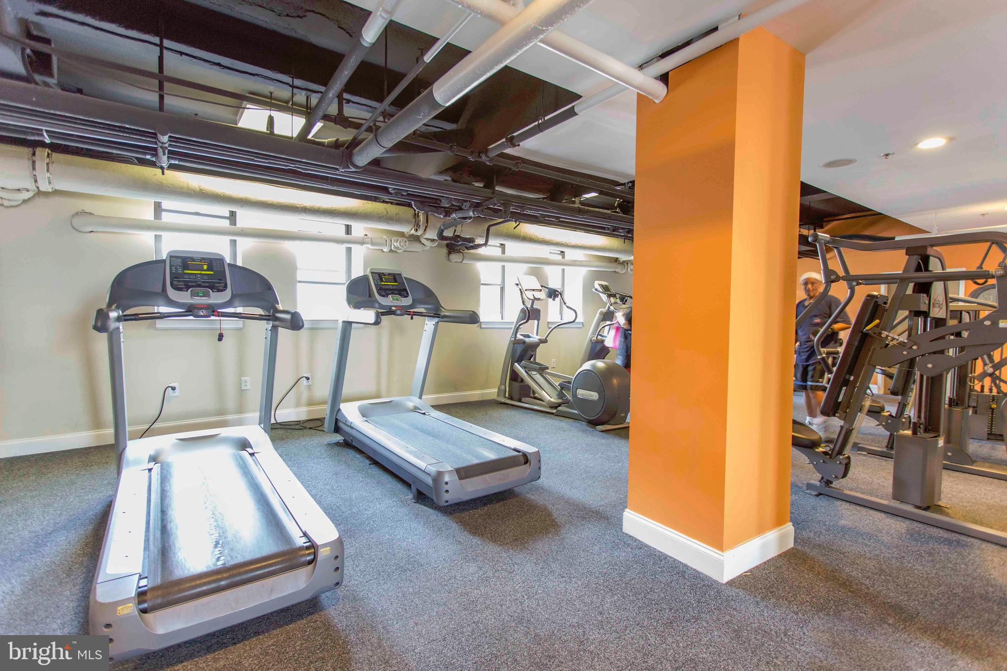 1229 Chestnut Street, Unit 325 Philadelphia, PA 19107 - Photo 8 of 19 a view of a room with gym equipment
