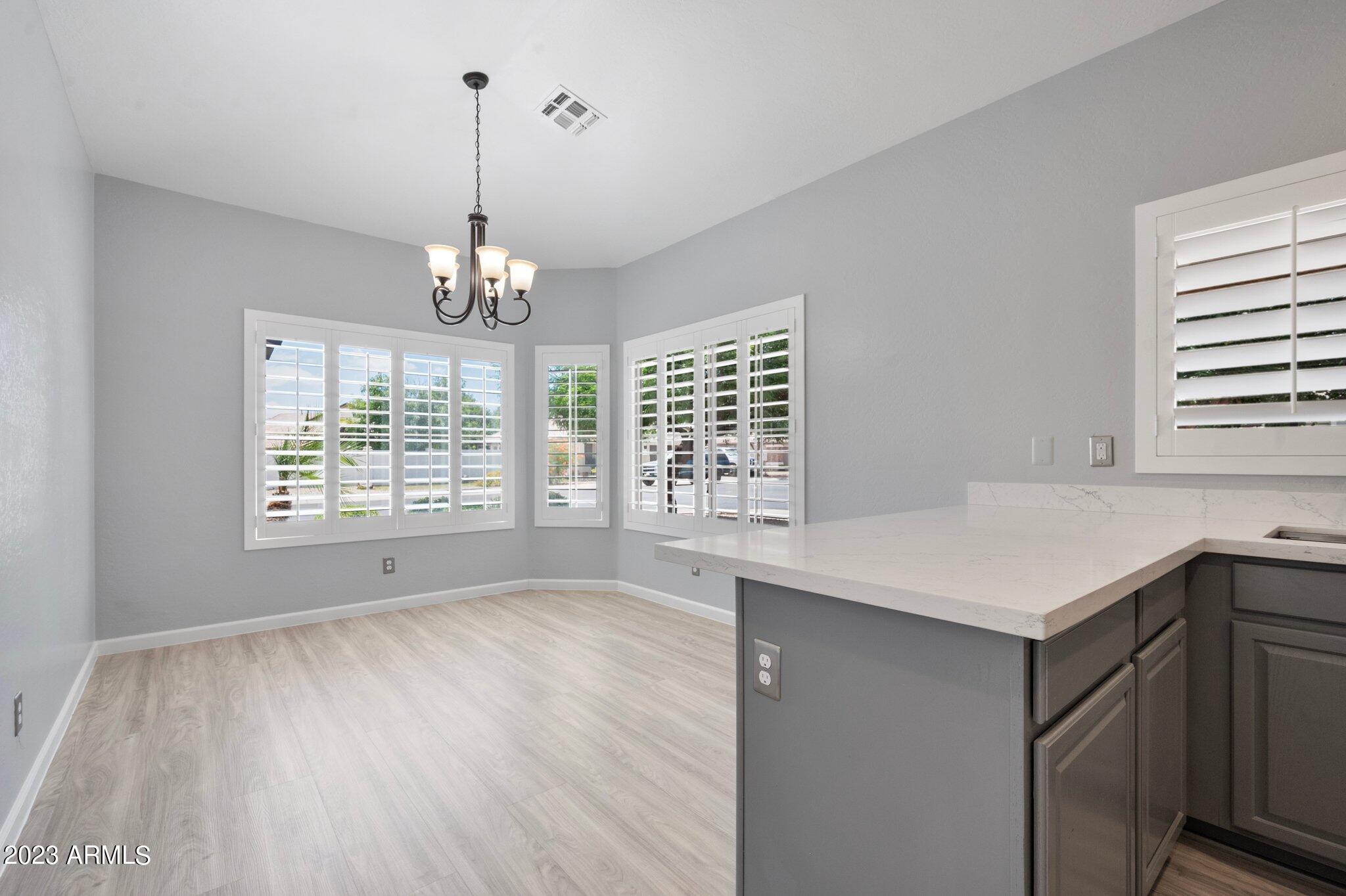 3354 East Bonanza Road Gilbert, AZ 85297 - Photo 8 of 23 a room with window and wooden floor