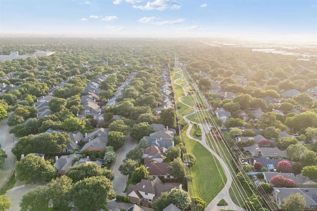 4115 Rive Lane Addison, TX 75001 - Photo 24 of 25 Aerial panorama showcasing a suburban neighborhood with extensive tree canopies