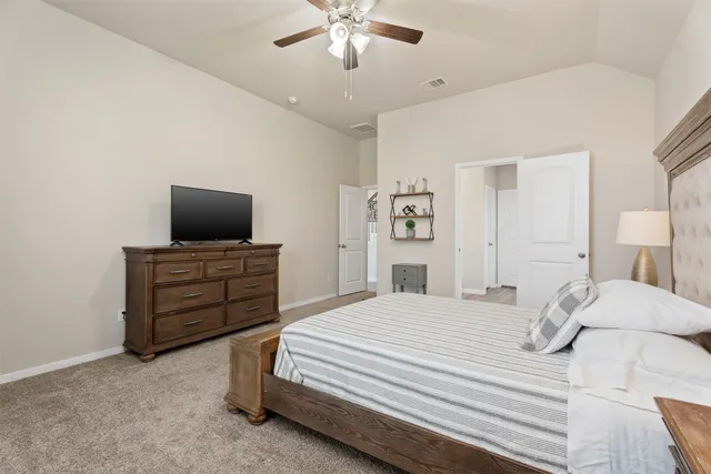 a en suite bathroom with a double vanity sink and a mirror