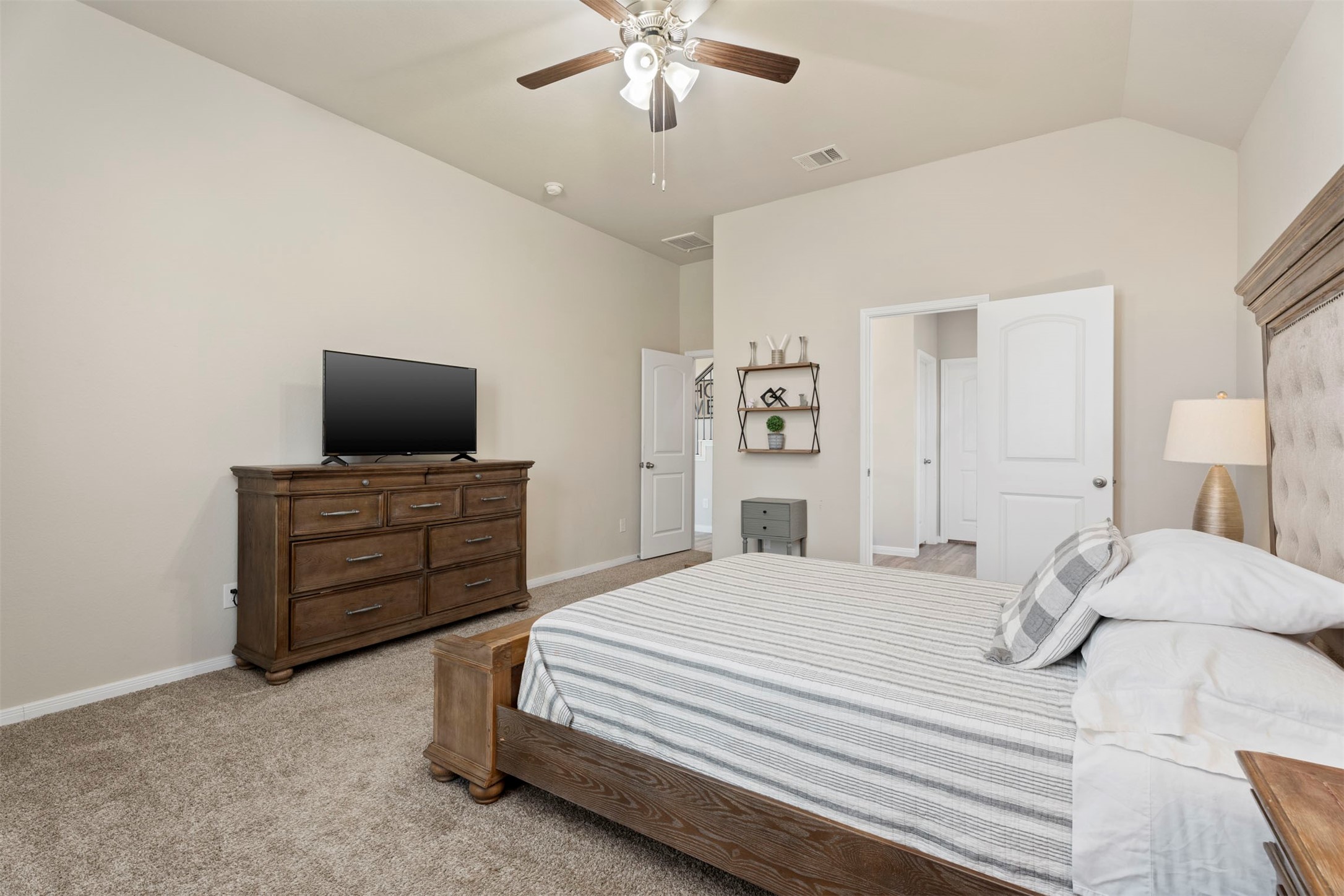 28109 Steepleridge Ct Spring Spring, TX 77386 - Photo 18 of 36 a bedroom with a bed and a flat screen tv