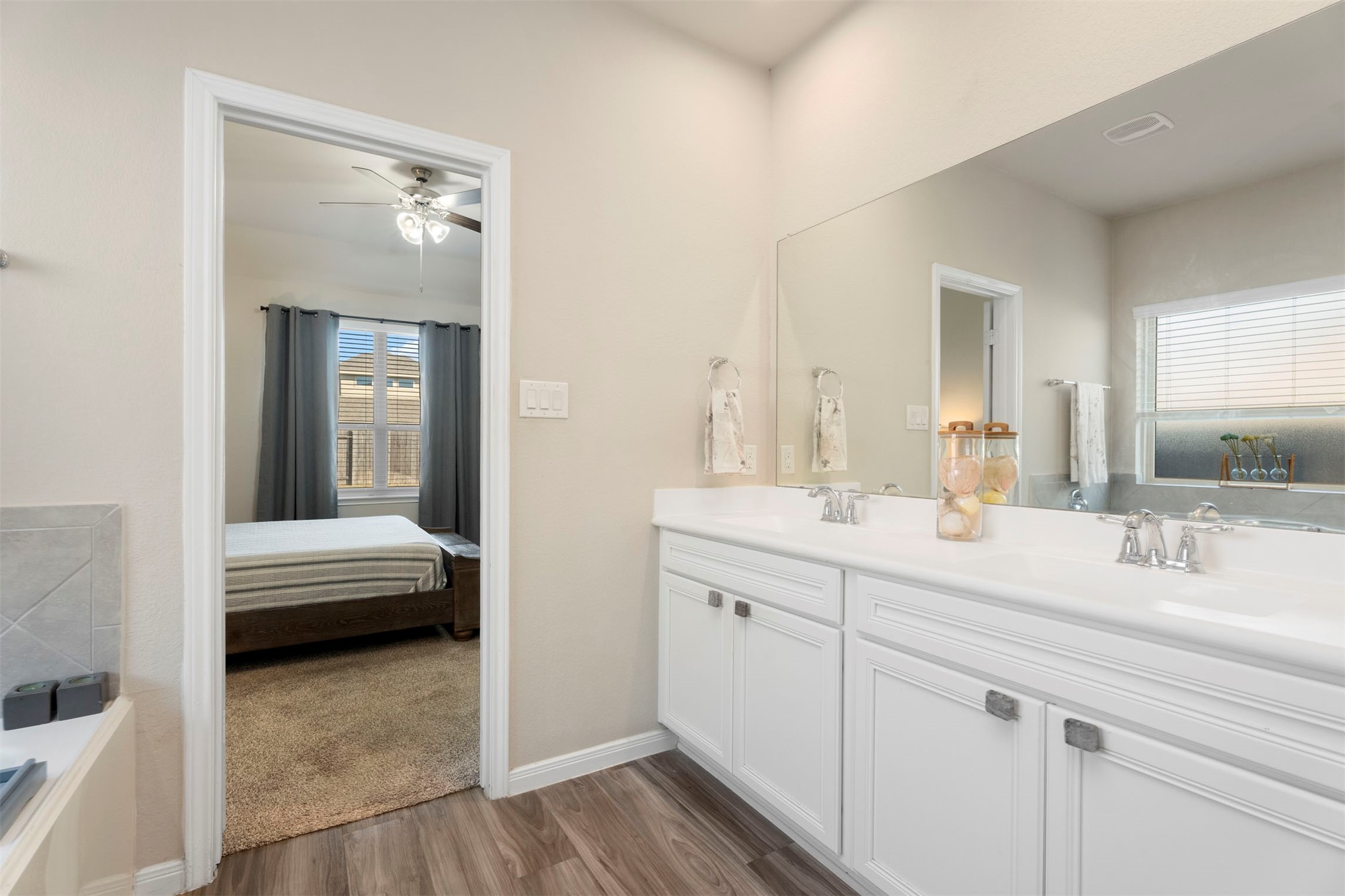 28109 Steepleridge Ct Spring Spring, TX 77386 - Photo 21 of 36 a en suite bathroom with a double vanity sink and a mirror