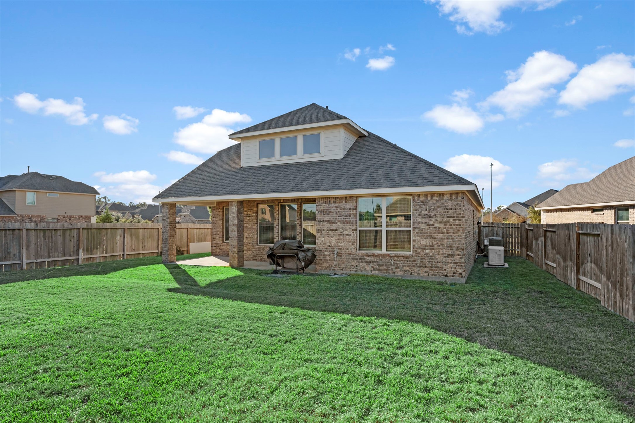 28109 Steepleridge Ct Spring Spring, TX 77386 - Photo 32 of 36 a view of a house with a yard and a garden