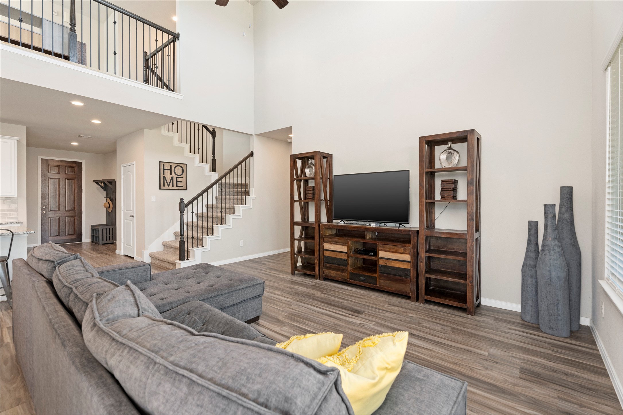 28109 Steepleridge Ct Spring Spring, TX 77386 - Photo 7 of 36 a living room with furniture and a flat screen tv