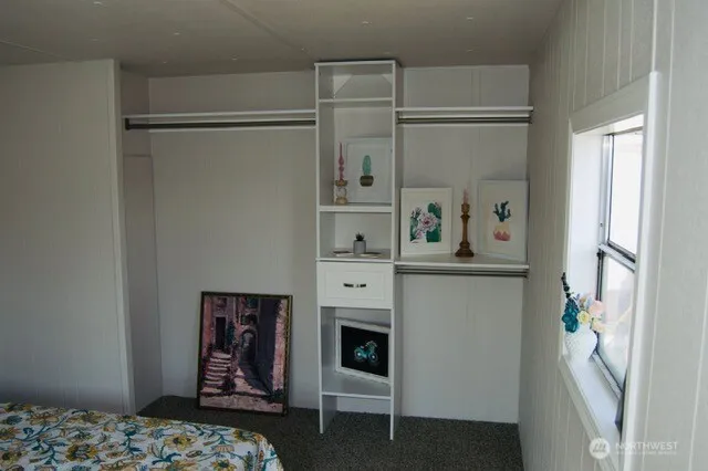 a bedroom with a bed and a fireplace