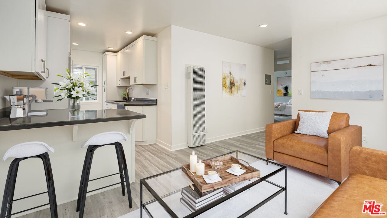 656 Indiana Avenue, Unit 2 Venice, CA 90291 - Photo 5 of 14 a living room with stainless steel appliances furniture a rug and a kitchen view