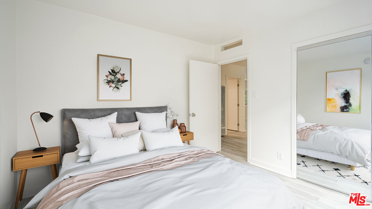 656 Indiana Avenue, Unit 2 Venice, CA 90291 - Photo 8 of 14 a bedroom with bed and cupboard