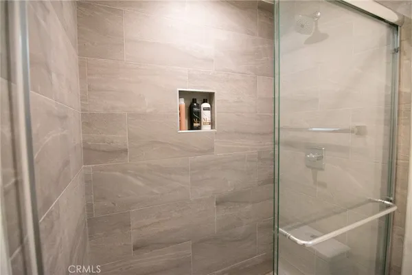 a bathroom with a bathtub and shower