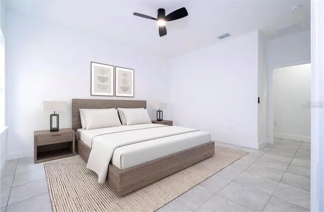 a bedroom with a bed and cabinets