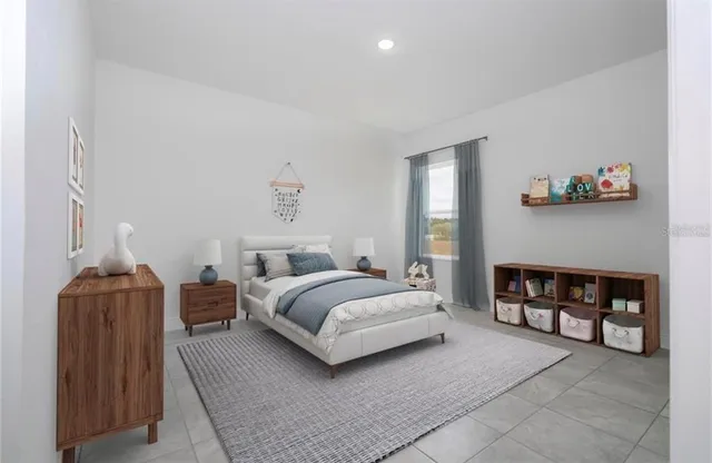 a spacious bedroom with a bed and a couch