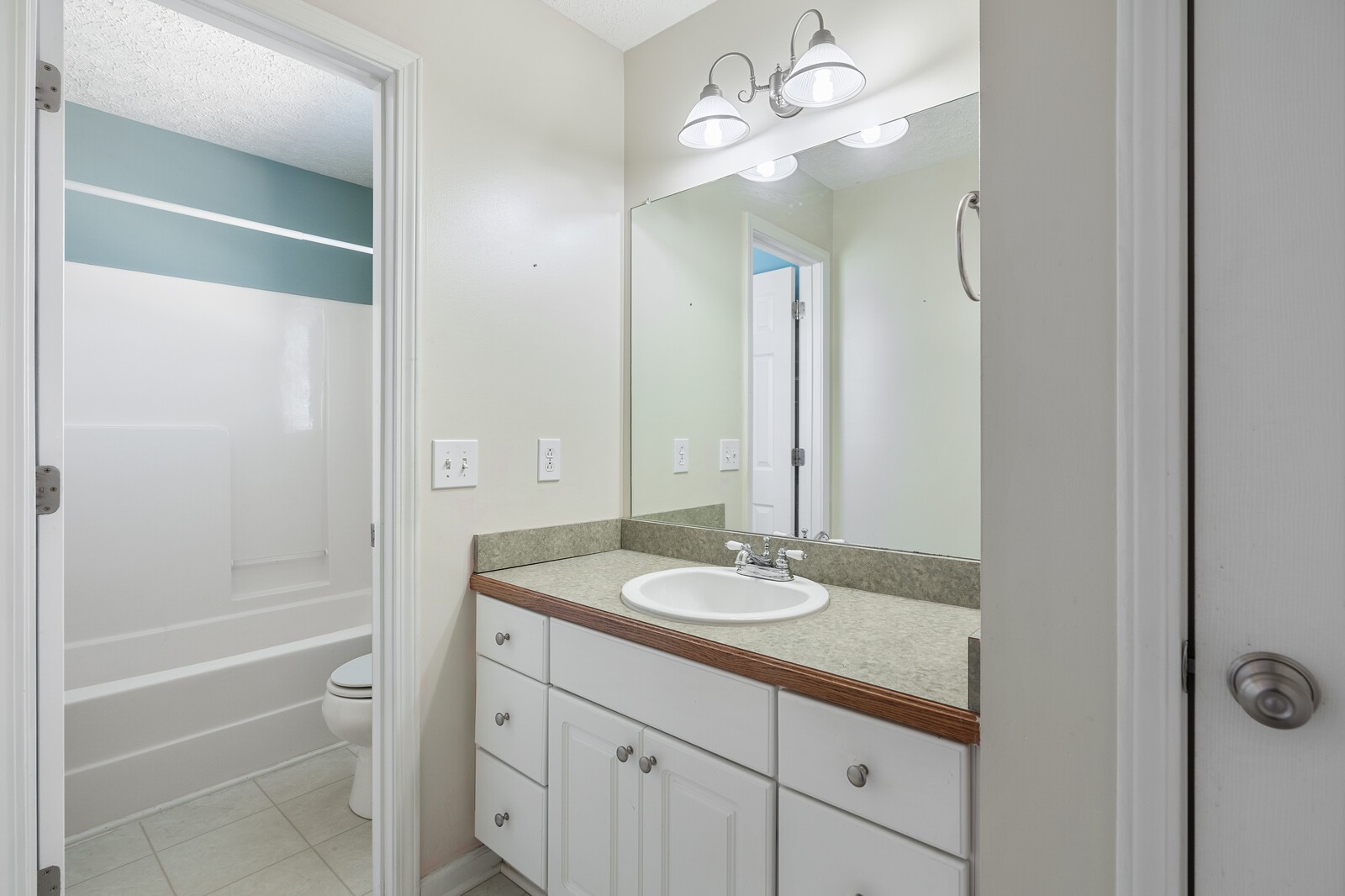 503 Berry Circle Springfield, TN 37172 - Photo 17 of 21 a bathroom with a granite countertop sink a toilet and shower