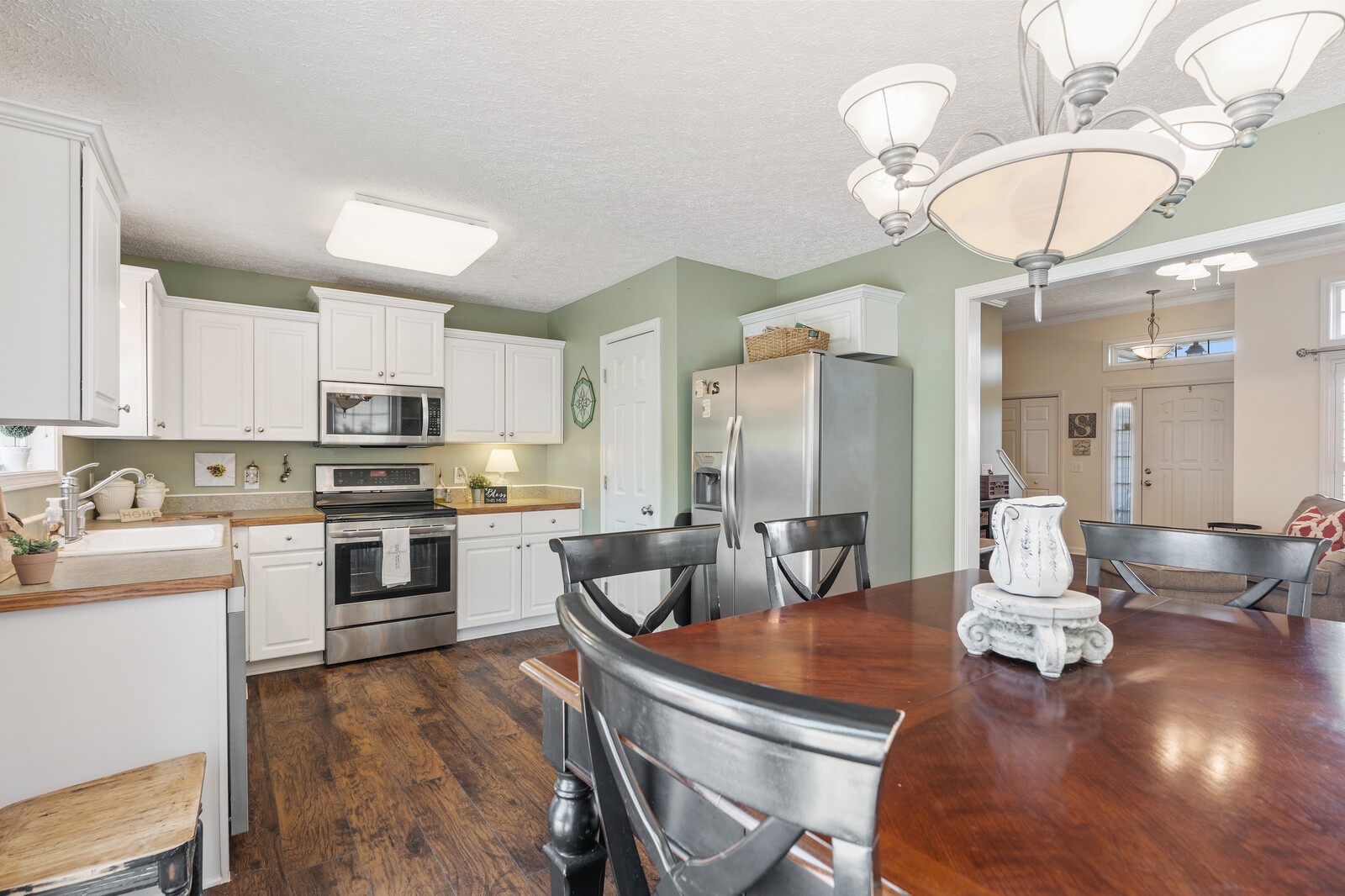 503 Berry Circle Springfield, TN 37172 - Photo 8 of 21 a kitchen with a dining table chairs wooden floor and appliances