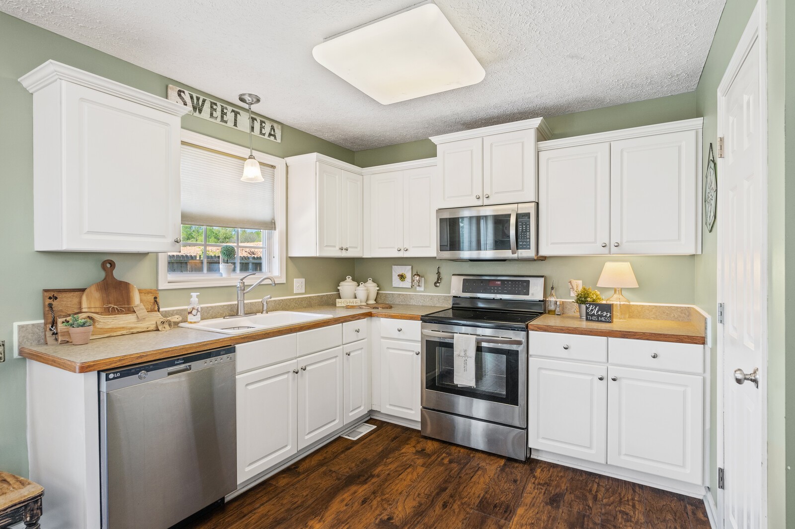 503 Berry Circle Springfield, TN 37172 - Photo 9 of 21 a kitchen with stainless steel appliances granite countertop a sink and cabinets