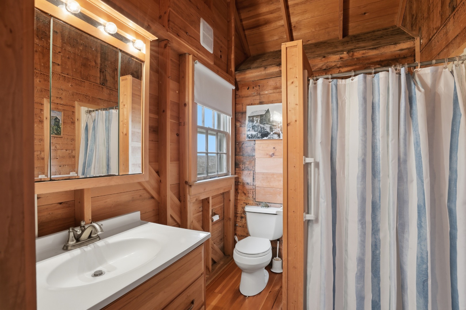 44 Madequecham Valley Road Nantucket, MA 02554 - Photo 9 of 19 a bathroom with a sink a toilet and shower