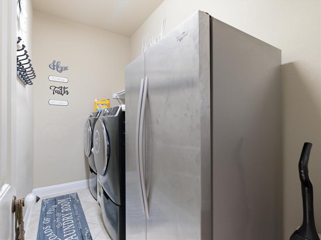 13788 El Toro Road Frisco, TX 75035 - Photo 26 of 29 Laundry area with light tile patterned floors and independent washer and dryer