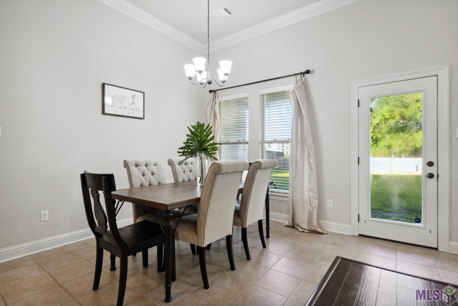 9426 Falling Oak Drive Baton Rouge, LA 70817 - Photo 14 of 25 Dining Room with Backyard Views