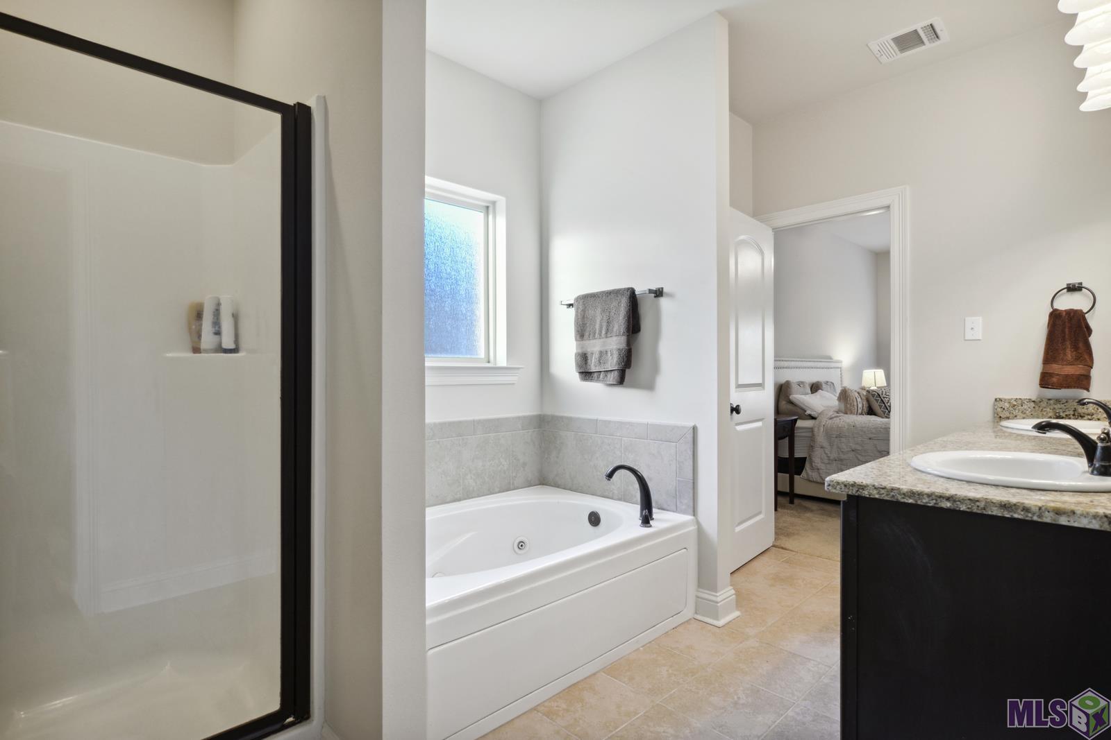 9426 Falling Oak Drive Baton Rouge, LA 70817 - Photo 18 of 25 Separate Shower & Jetted Tub